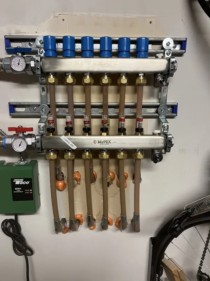 Plumber performing Water Heater Repair at a residential property in Norwich